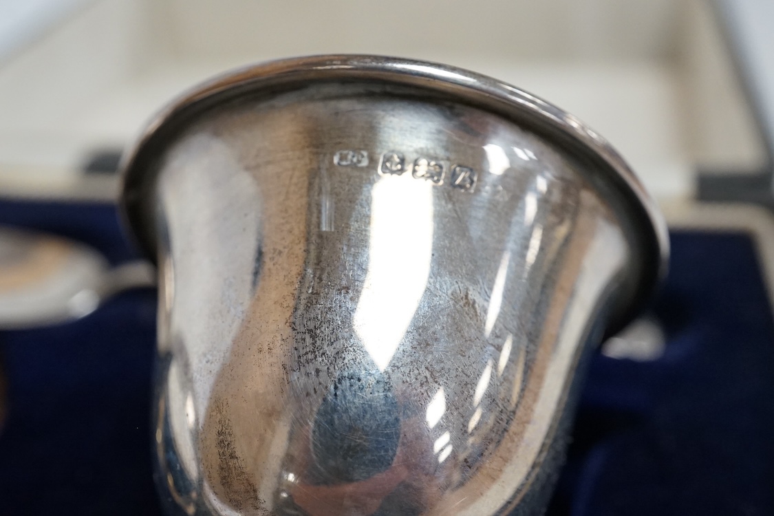 Three assorted silver christening sets including spoon, fork and napkin ring by William Hutton & Sons, London, 1896, one other set with steel knife, two cased sets of silver coffee spoons and a cased set of six Japanese